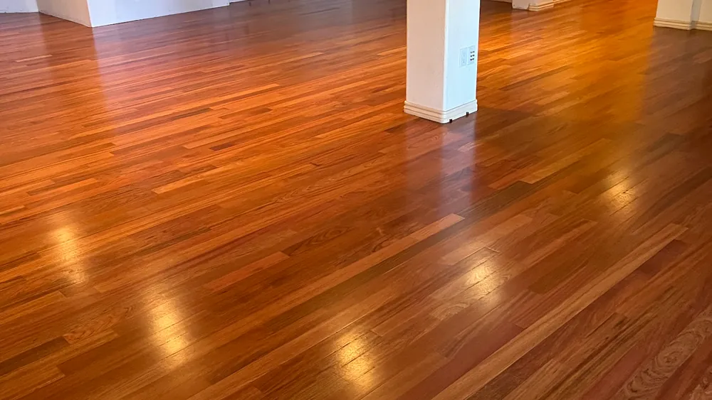Glossy cherry-toned hardwood floor